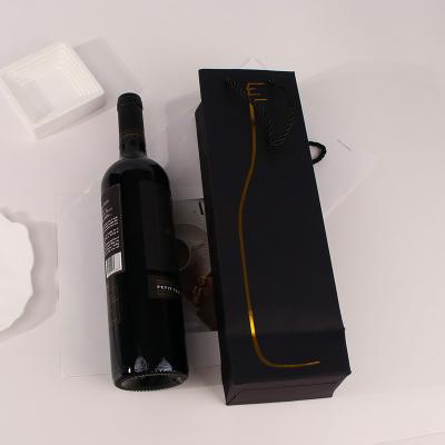 China Recyclable Custom Printed Logo Back Kraft Paper Drawstring Handle Gift Packaging Bag For Wine Bottle for sale