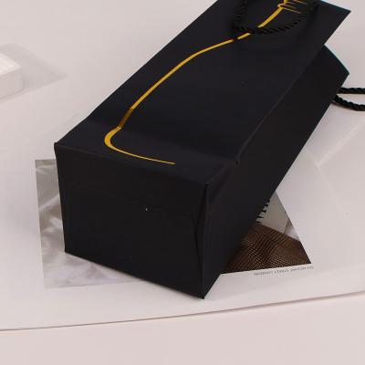 China Recyclable Biodegradable Recycled Black Paper Gift Handle Kraft Drawstring Packaging Bag For Wine Bottle for sale