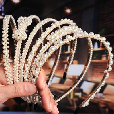 China New Friendly Material Luxury Large Pearl Headband Women Bows Sunflower Circles Girls Hair Accessories Shape Jewelry Accessories for sale