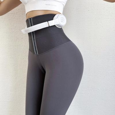 China Breathable 2 In 1 Women Yoga High Waist Butt Lifter Compression Belt Trimmer Elastic Leggings With Custom Logo for sale