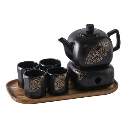 China Viable Black And White Porcelain Tea Set Porcelain Coffee Cups Tea Set With Wood Warmer And Tray for sale