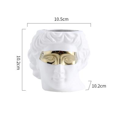 China Europe New Launch Women Face Shape White Ceramic Flower Pot Holder With Luxury Golden Decoration for sale