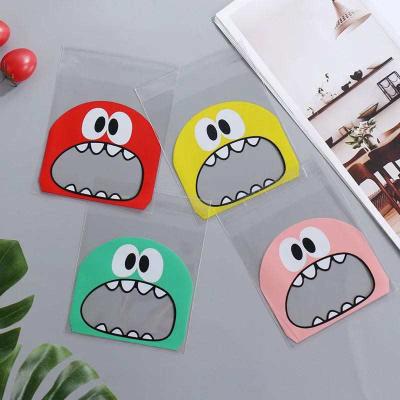 China Safety Plastic Bag Wedding Birthday Cookie Candy Gift Packaging Bags 100Pcs Cute Big Mouth Monster OPP Self Adhesive Gifts for sale