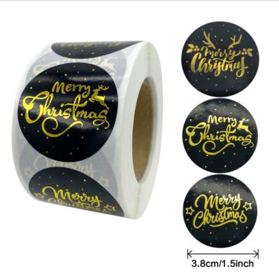 China Waterproof Round Gold Foil Merry Christmas Decoration Gift Box Hot Stamping Black Roll Stickers for sale