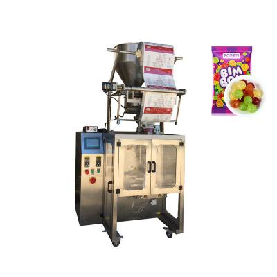 China KEFAI Small Automatic Food Candy Packaging Machine With Measuring Cup Rotary Candy Filling Packaging Machine for sale