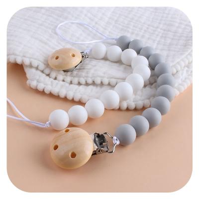 China Wholesale BPA BPA Free Food Grade Silicone Wood Metal Baby Feeder Newborn Free Pacifier Clips for sale