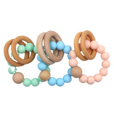 China BPA Free Baby Silicone Beads Chewable Wooden Ring Rattles Teether Bracelet Teething Toys for sale