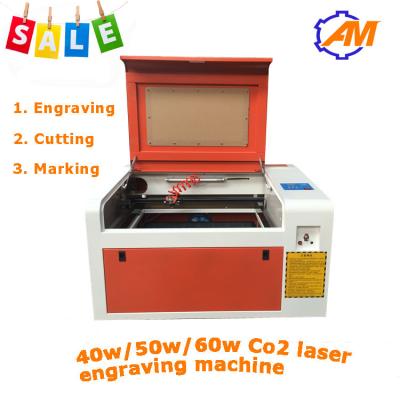 China Mini laser do CO2 que grava o gravador For Acrylic da máquina de corte 40W à venda