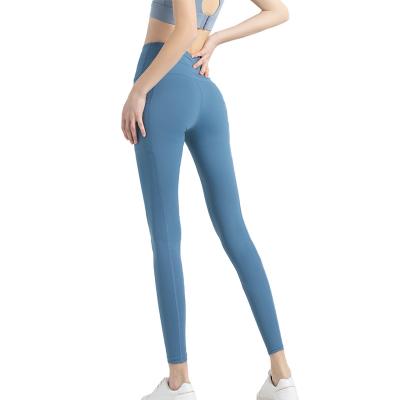 China Breathable Non-marking Cropped Pants With Side Pockets Women's Seamless High Waist Fitness Pants Quick-Drying Solid Color Stretch Tights for sale