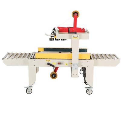 China FXJ-4030 CLOTHING Small Box Tape Tying Machine Carton Sealer for sale