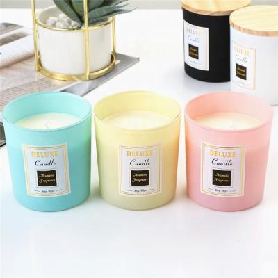 China Home Decoration Empty Frosted Black Amber White Yellow Grey Pink Green Glass Candle Jar With Lid for sale