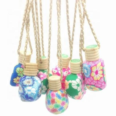 China Personal Care Hot Sale Soft Clay Floral Car Perfume Bottle Hanging Car Perfume Bottle for sale