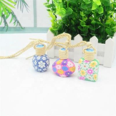 China Personal Care Hot Sale 12Ml-15Ml Clay Car Hanging Glass Perfume Bottle Ceramic Bottle Perfume for sale