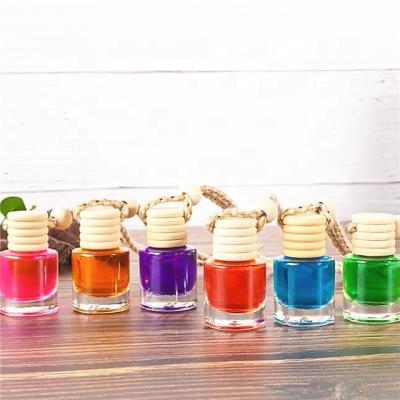 China Personal Care Empty 5Ml 8Ml 10Ml Wood Cap Car Bottle Perfume Cylinder Shape Glass Perfume Bottle for sale