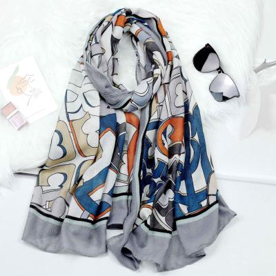 China Designer Geometric Printed Scarf Style Cotton Linen Soft Feel Soft Graffiti Style New Feel Printed Shawl for sale