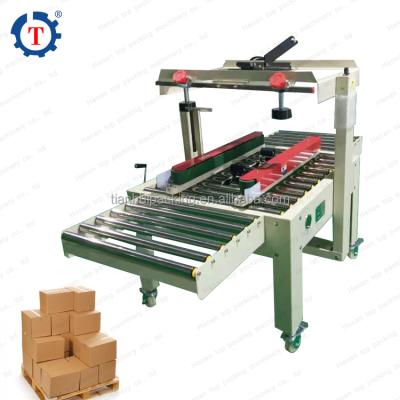 China Hot Sale Semi Automatic Fruit Carton Box Express Box Strip Carton Sealing Machine for sale