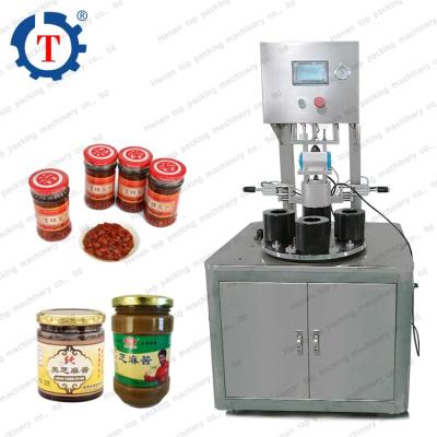 China Food High Capacity Juice Roll Aluminum Foil Film Glass Bottle Sealing Machine Vacuum Capping Machine for sale