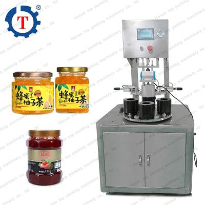 China Food High Capacity Juice Roll Aluminum Foil Film Glass Bottle Sealing Machine Vacuum Capping Machine for sale