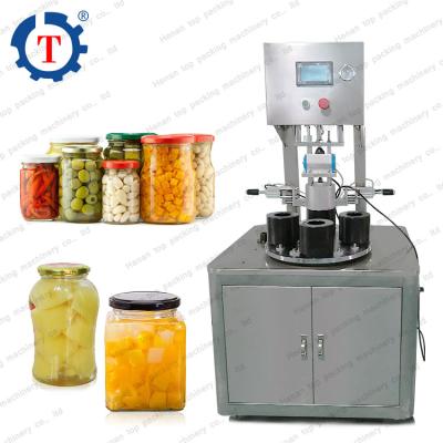 China Small automatic food induction lids sealing machine for bottle and jar vacuum capping machine for sale