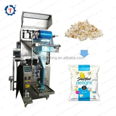 China Automatic Food Corn Puff Snacks Wrought Snacks Four Heads Bucket Pellet Packing Machine for sale