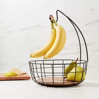 China Sustainable Home Storage Organizer Round Black Metal Wire Fruit Basket Bowl With Banana Hanger for sale