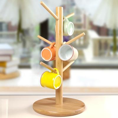 China Viable Hot Selling Countertop Bamboo Wood Coffee Cup Holder Tree Organizer Stand Holder Leaf Cup Holder for sale