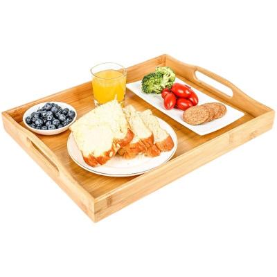 China Sustainable Wholesale Cheap Natural Kitchen Food Bamboo Wooden Serving Trays With Handles for sale