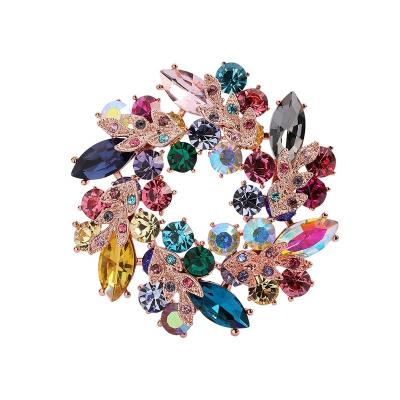 China Custom Alloy New Product Wedding Multicolor Crystal Bauhinia Brooches Flower Rhinestone Garland Brooch Pin for sale