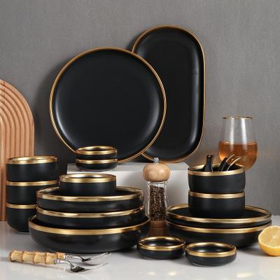 China Sustainable Dinnerware Sets Black Dishes Ceramic Luxury Dishes Sets Party Tableware With Gold Rim for sale