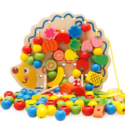 China Montessori Modern Educational Toys Simplicity Wooden Hedgehog Fruit Stringing Bead Games Children Lacing and Threading Toys for sale