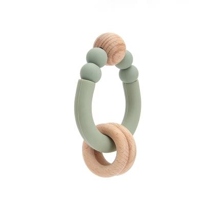 China Soft Toy New Design Sensory Baby Teething Toys Ratchet Soft Wooden Baby Teether Ring Silicone Teether Bpa Free for sale