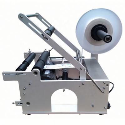 China tabletop semi automatic sticker applicator food bottle labeling machine for sale