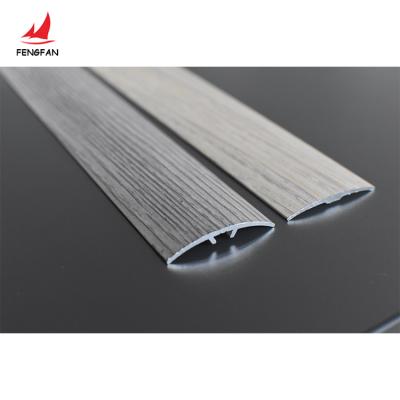 China Modern Wood Effect Aluminum Tile Trims Floor Trim Transition Metal Strips for sale