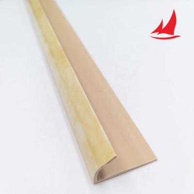 China Modern Building Material PVC Stair Sniffing Skirting Edge Plastic Ceramic Tile Protector for sale