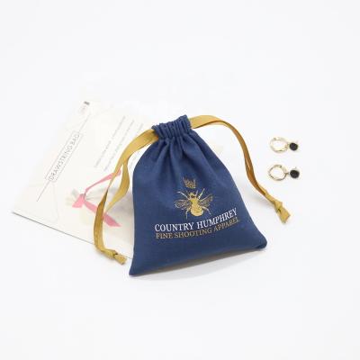 China Eco Customized Blue Canvas Drawstring Pouch Gift Bag Cotton Muslin Eco-Friendly Jewelry Packaging Bag for sale