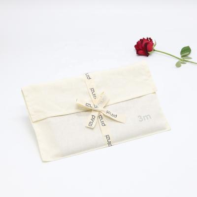 China Soft Eco-friendly Cotton Muslin Envelope Gift Packing Shoe Bag With Bow Belt Apparel Packing Envelope Cotton Pouch for sale