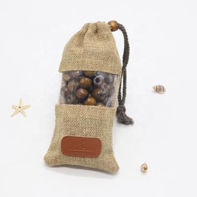 China Hessian Soft Wood Hessian Jute Leather Label Bag Gift Jute Bead Drawstring Single Pouch Bag with PVC Window for sale