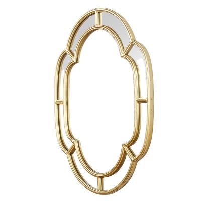 China Large Flower Shape Metal Frame Hotel Makeup Mirror Minimalist Gold Oval Decorative Wall Mirror for sale