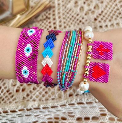 China FASHIONABLE Chaobao Popular Miyuki Series Eyes Love Pearl Cross Bracelet Mixed Color Handmade Pull Rope Jewelry for sale