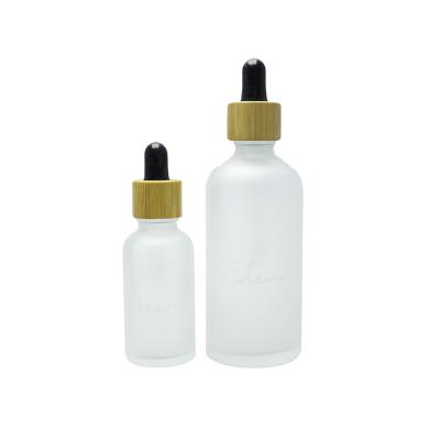 China Hot Sale 30ml 50ml Cosmetic Essential Oil Dropper Glass Bottle Frosted Bamboo Glass Dropper Bottle Round-42S for sale