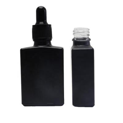 China Matte Oil Cosmetic Square Frosted Serum 30ml Black Essential Glass Dropper Bottles Round-14S for sale