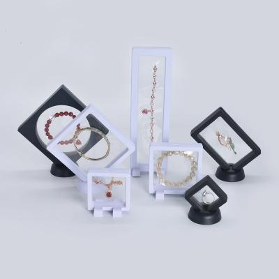 China Fashion 7x7 9x9cm slim hanging frame display case 3d floating square transparent pvc plastic pe film packaging dustproof jewelry box for sale