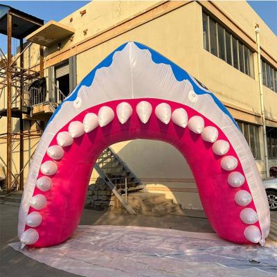 China PVC tarpaulin cloth/420D Oxford clothes 2021 newest customized inflatable arches/shark mouse arcade for sale