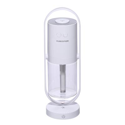 China Can rotate 360Â ° Rotating Head Spray Seven-color Night Light Auto Shaking Humidifier for sale