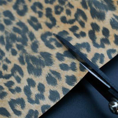 China la tela de Tyvek del estampado leopardo 75gsm recicló el modelo de encargo impreso en venta