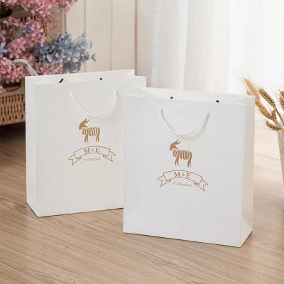 China Recyclable Wholesale Custom Paper Bag Handle Bag Luxury Art Printing Paper Bag With Your Own Logo for sale