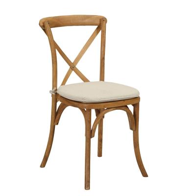 China Popular Nice White Solid Wood Wedding Stacking Cross Back Dining Chair With Soft Cushion for sale