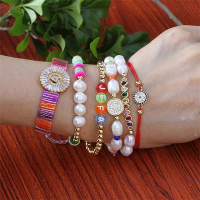 China Modern Manufacturers Adjustable Copper Custom Women CZ Braided Letter Bracelets for sale