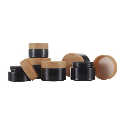 China 5g 10g15g 20g 30g 50g Matte Black Glass Cream Jar Cosmetic Empty Round Shape Cosmetic Jar With Bamboo Lid for sale