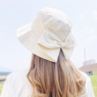 China New Fashion Candy Cute Women Girl Fashion Overflow Wide Bow Bucket Hat Leisure Straw Hat Outdoor Beach for sale